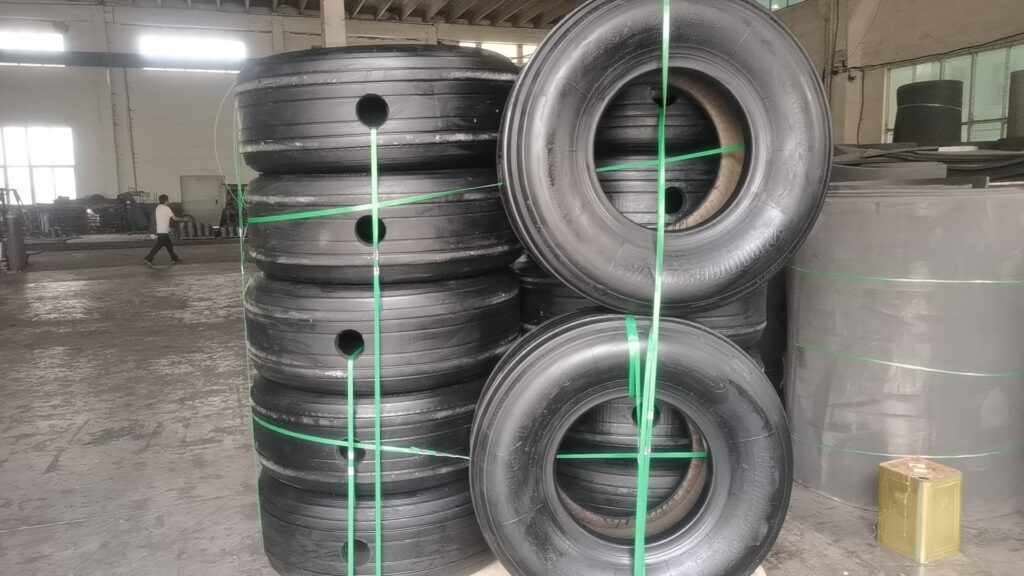 Custom-drilled aircraft tyres for pneumatic fender tire-chain net systems
