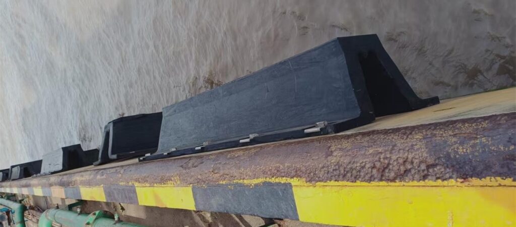 Arch rubber fenders installed along a dock berth for vessel berthing and quay wall protection
