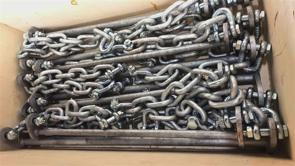 Chains, shackles and support bars packed for cylindrical rubber fender installation