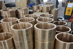 Custom bronze marine components and bushings for vessel and offshore equipment