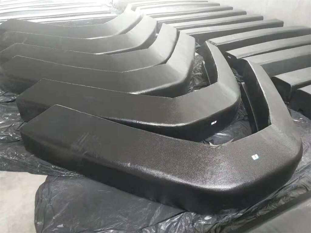 Custom EVA yacht fenders in production with curved bow fender shapes