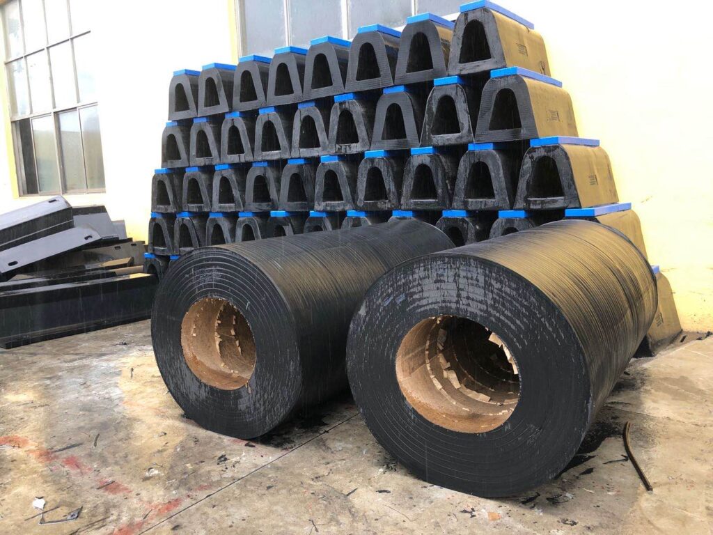 Finished cylindrical rubber fenders prepared for appearance and size inspection