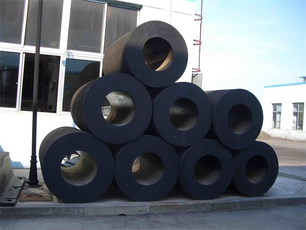 Cylindrical rubber fenders stacked and ready for shipment