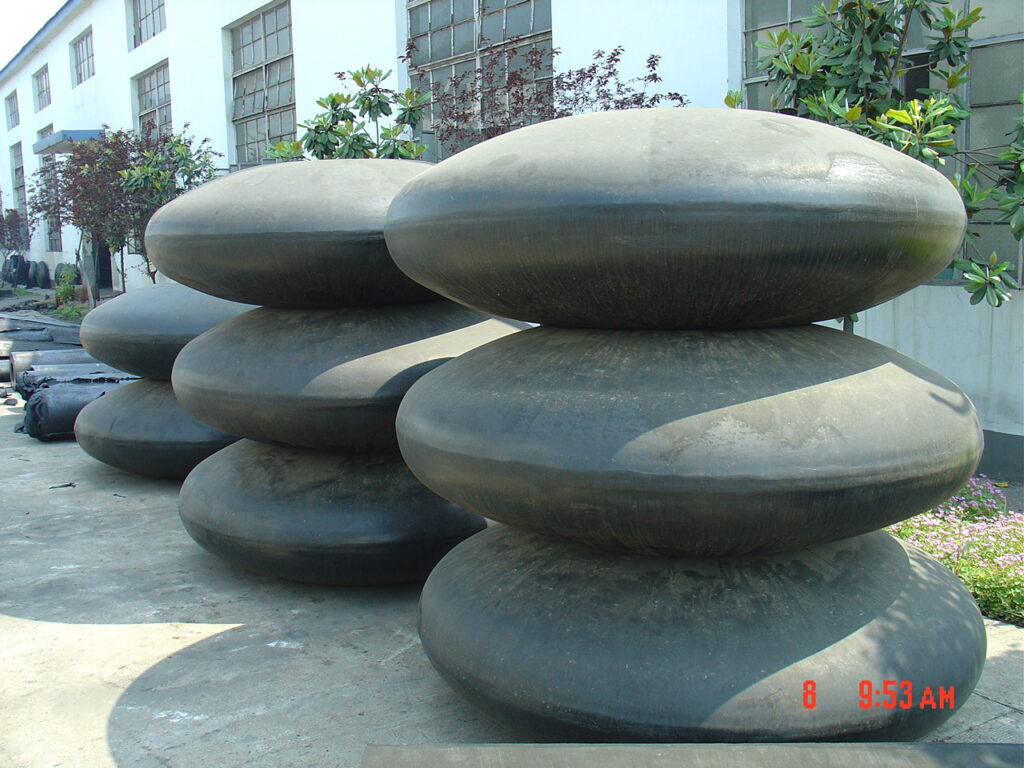 Dock wheel fender rubber wheels stored in factory for marine roller fender systems