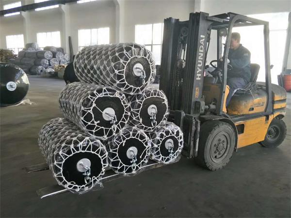 Foam filled fenders with protective rope net in factory for boat and marine berthing applications