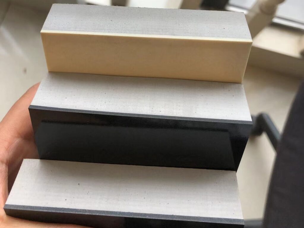 Laminated EVA foam fender material sample showing layered black and white foam structure