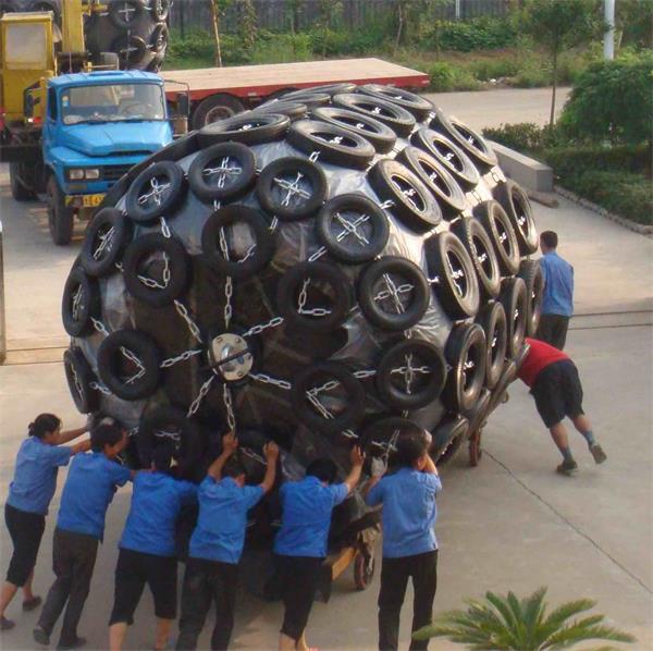 Large foam filled fender with chain tire net for ship berthing and marine dock protection