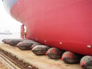 Large vessel supported by ship launch airbags during launching preparation