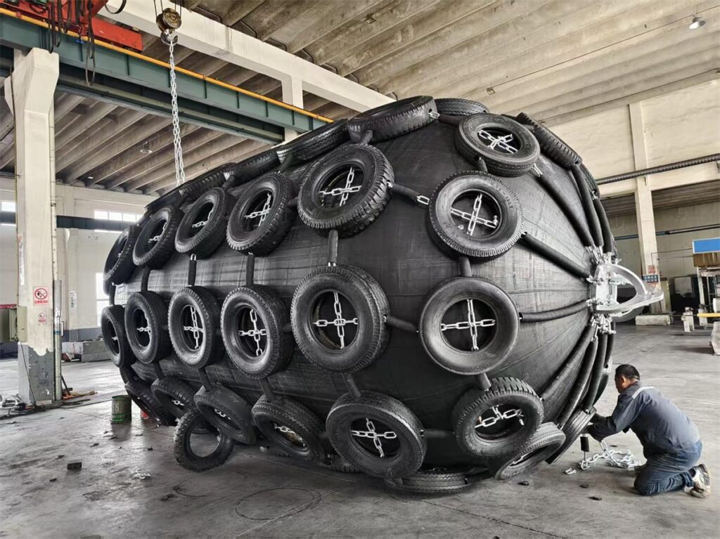 pneumatic rubber Pneumatic rubber fender with tire chain net being assembled in the factory