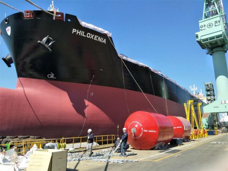 Red foam filled fender used for ship berthing protection at dock