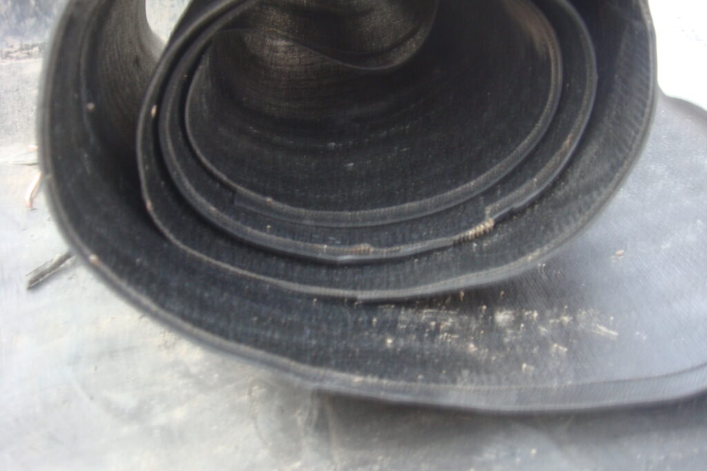 Close-up view of reinforced rubber layer structure inside a ship launch airbag