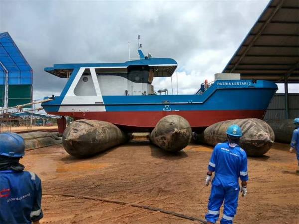Boat supported by ship launch airbags during launching operation in a shipyard