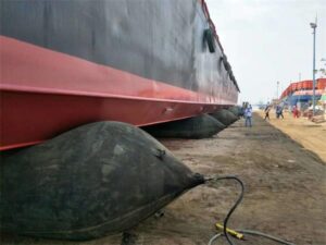 Ship launch airbags positioned under vessel hull during launching preparation