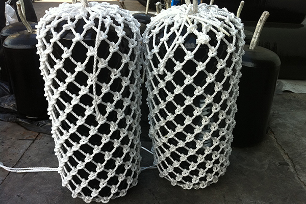 Single-end hanging foam filled fenders with rope net for boat and dock protection