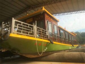 Small vessel supported by marine rubber airbags during launching operation