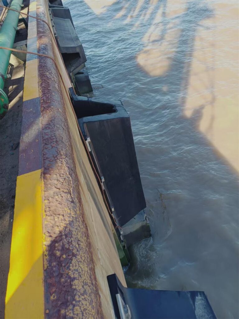 Standard rubber arch fender installed on a dock structure for vessel berthing protection