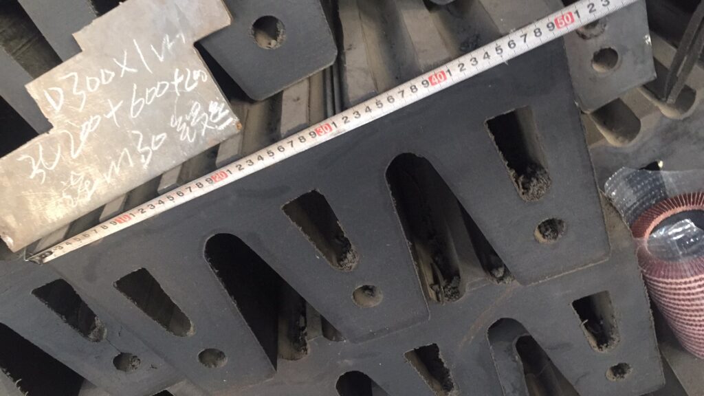 W rubber fender dimension checking with measuring tape in factory