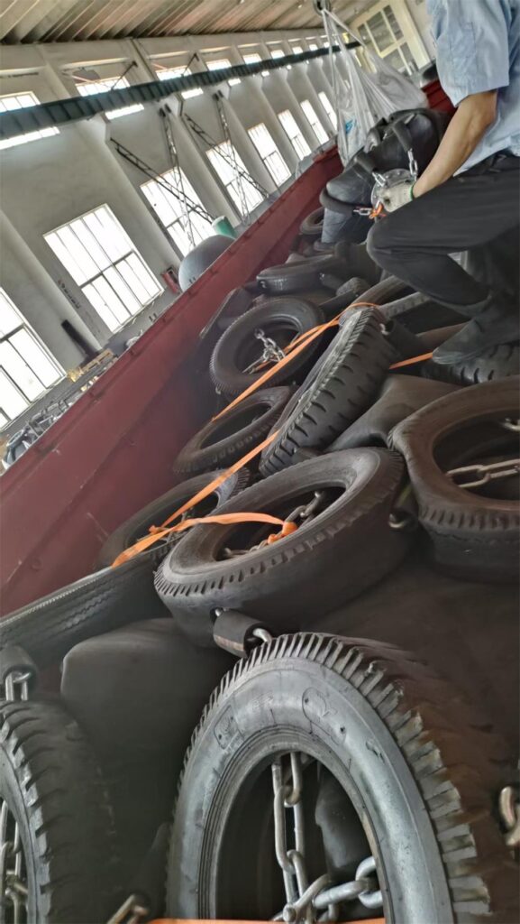 Deflated large pneumatic rubber fenders prepared for shipment