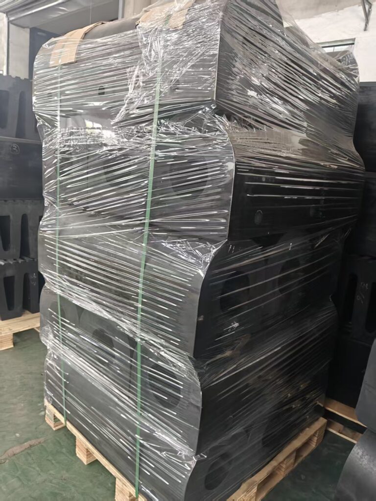 Packed D rubber fenders on pallets for shipment