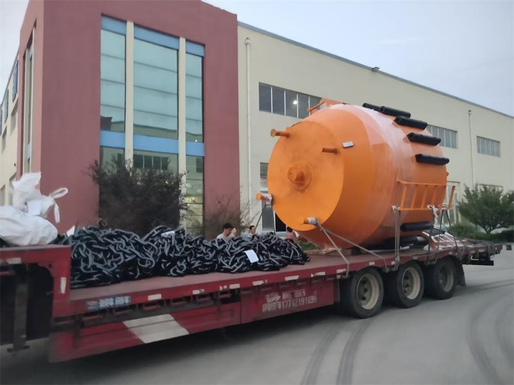 Custom steel buoy and mooring chains prepared for shipment
