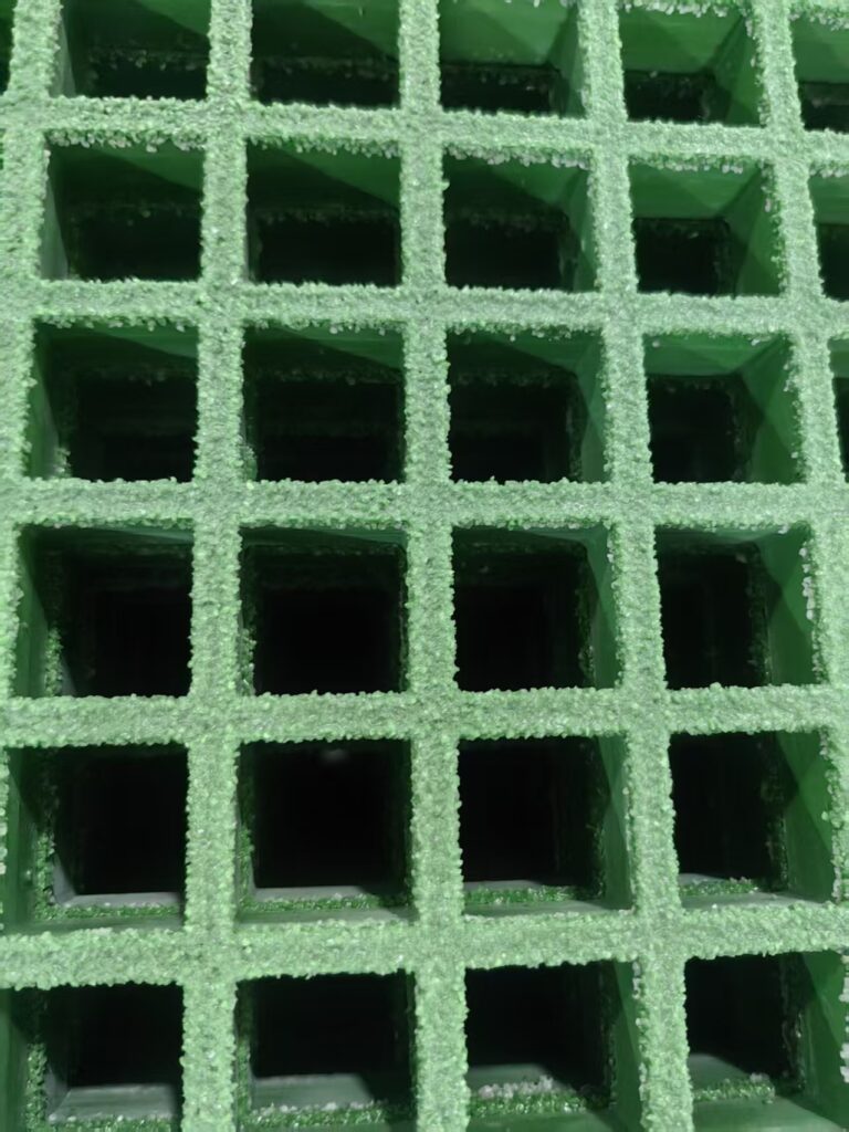 Close-up of grit-top anti-slip FRP grating surface for wet boat deck flooring