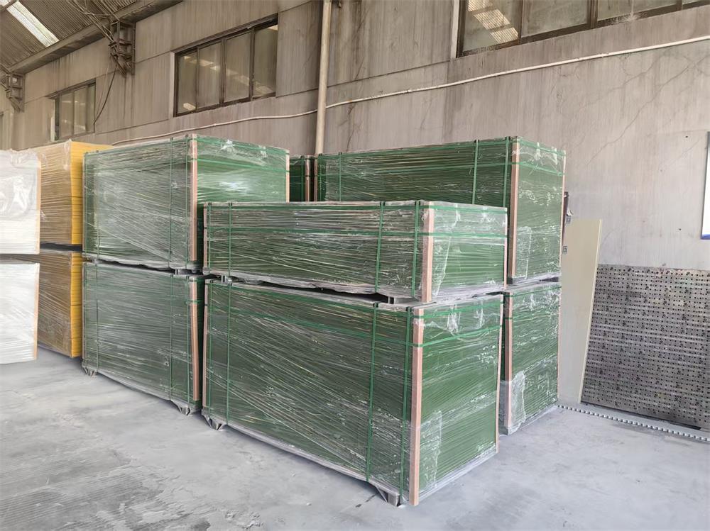 Green grit-top FRP grating panels securely packed for shipment to Argentina