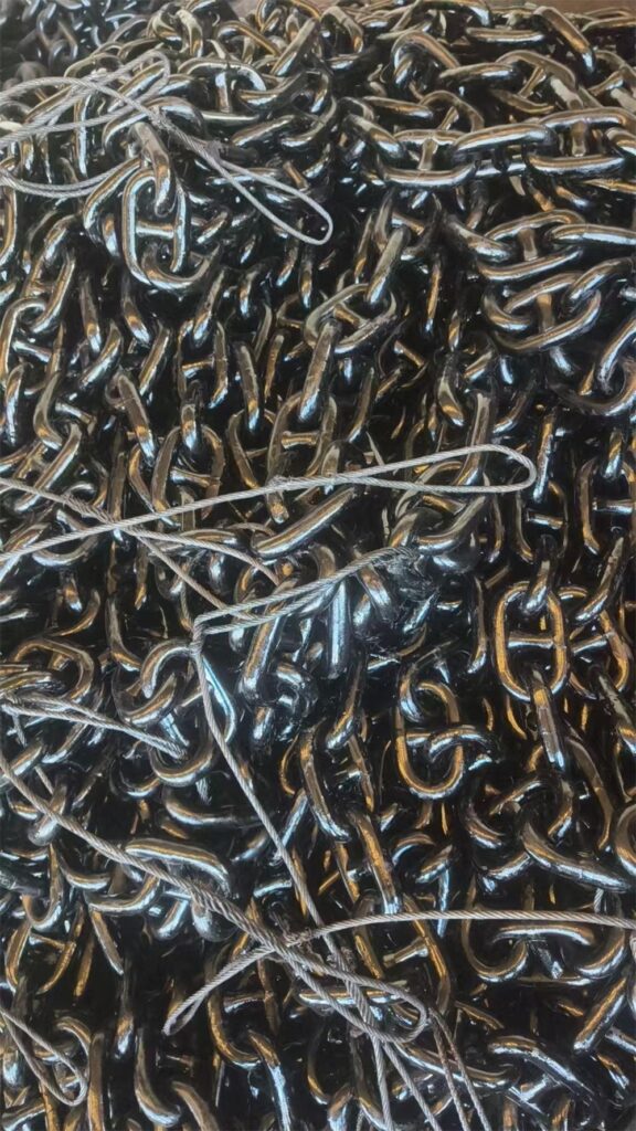 Close-up of black coated U2 26 mm stud link ship anchor chain